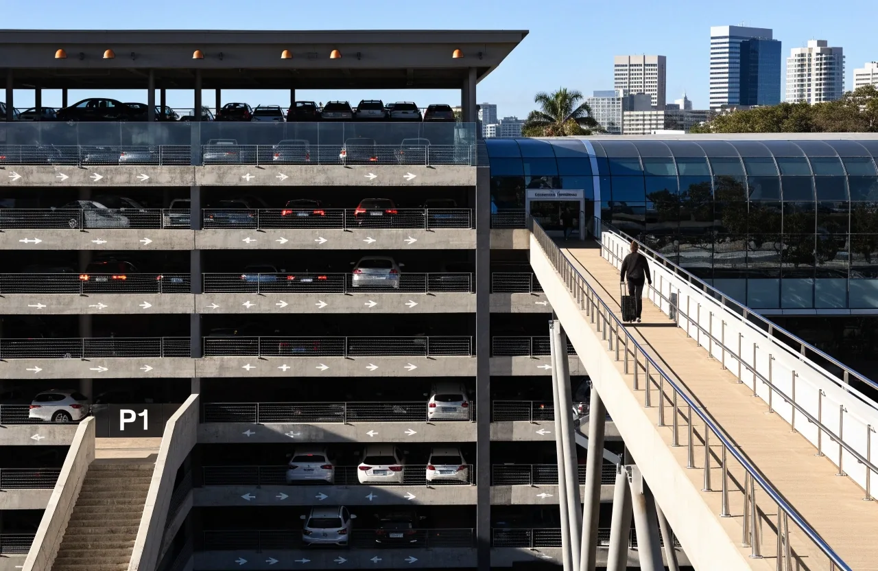 Multi-level P1 and P2 car parks exterior with pedestrian bridge to domestic terminal